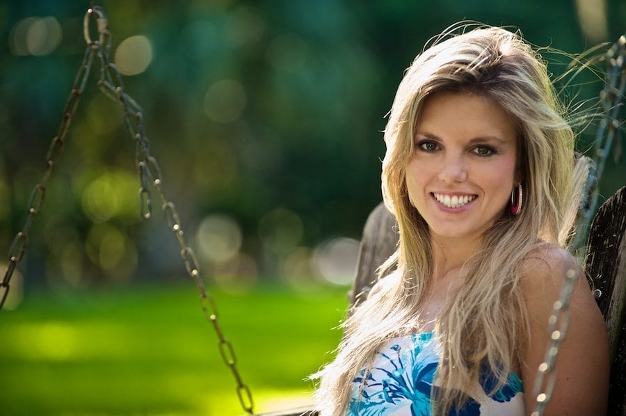 The Girl with the Sun in Her Hair Smiling Young Blonde Woman