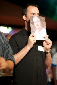 Matt Kloskowski holding photo of Ken Toney