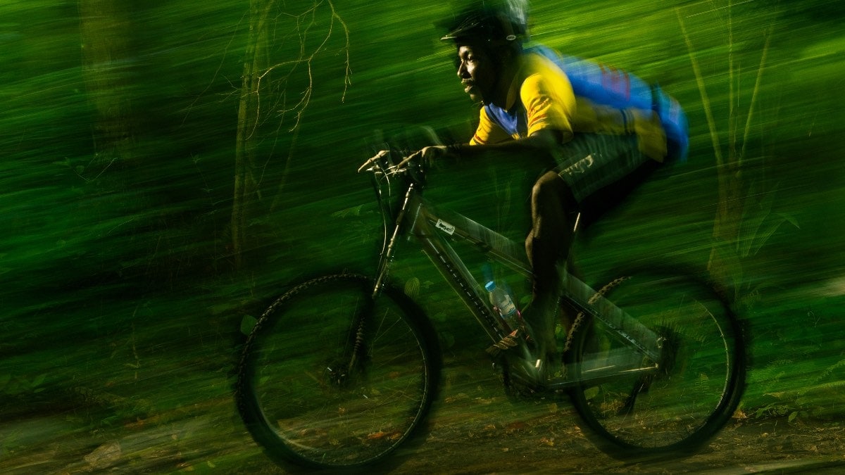 Flash lighting mountain biker in motion